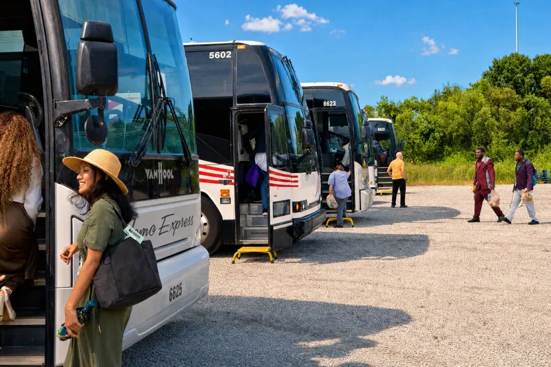 Riders arriving at a line of coaches
