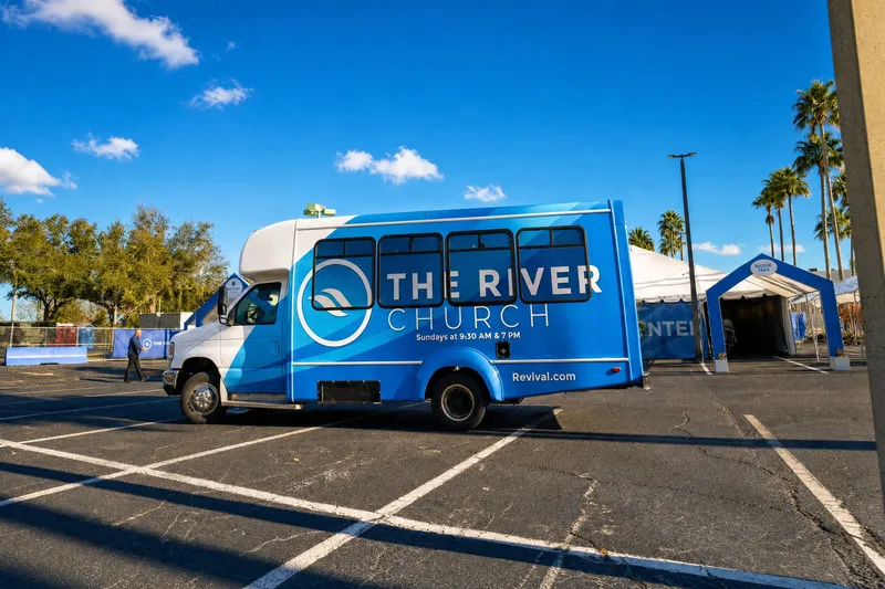 The River Church shuttle bus in the church parking lot